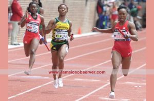 Jamaica’s Shelly-Ann Fraser-Pryce (centre) finishes second behind United States’ Carmelita Jeter (right) in the 4x100m event at the Penn Relays yesterday.Photo: Collin Reid courtesy of Supreme Ventures, Courts and Team Jamaica Bickle
